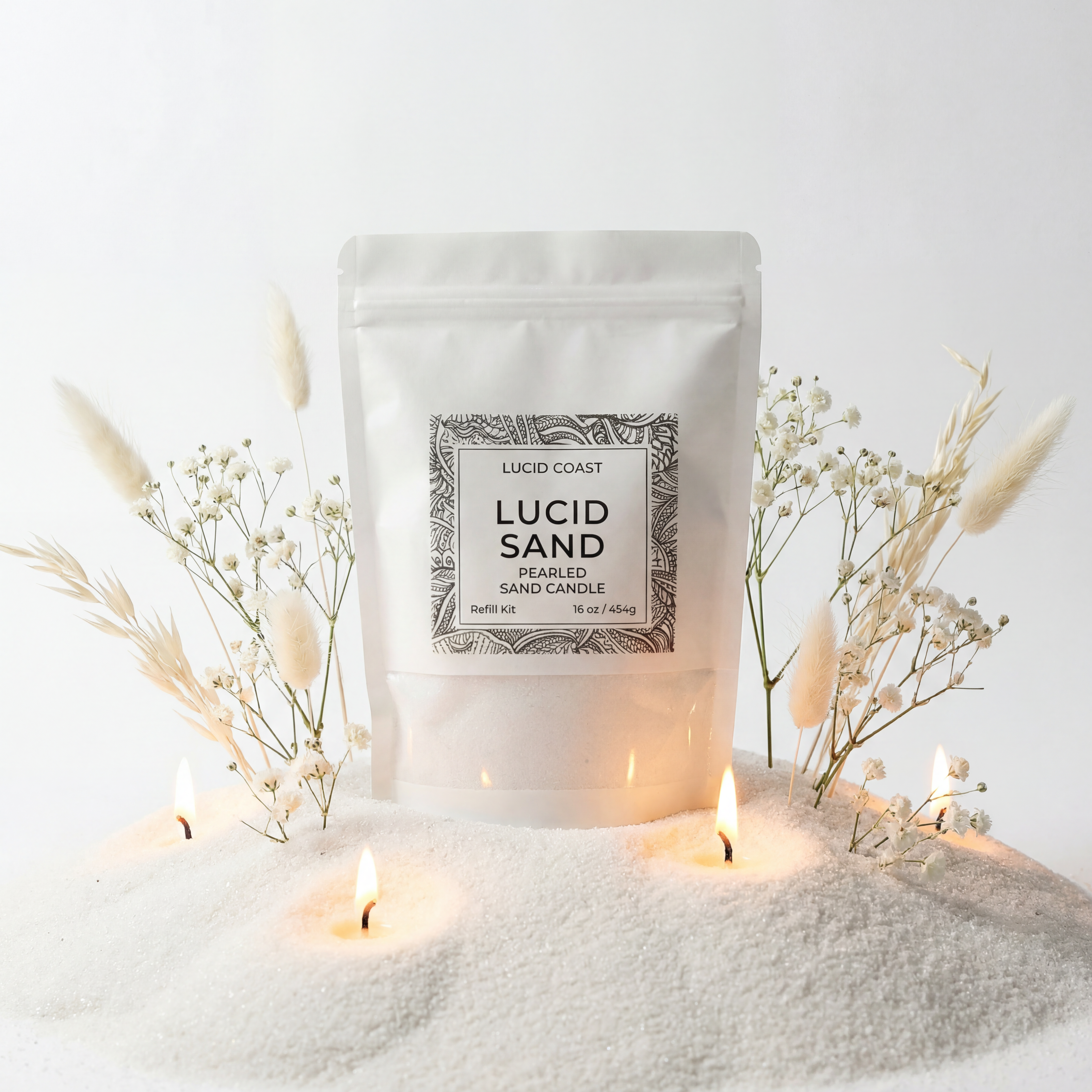 Lucid Sand Refill pouch on white sand with lit wicks, refillable pearled sand candle wax pearls for DIY heat-proof container candles